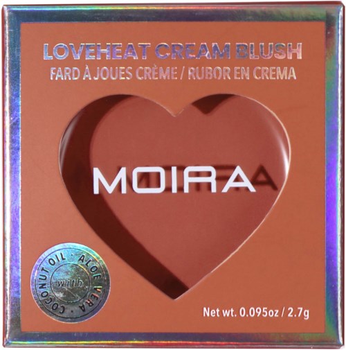 A blush compact with a heart-shaped window, labeled 'Loveheat Cream Blush' by Moira, with net weight 2.7 grams.