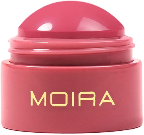 Pink container with a dome lid labeled 'MOIRA'. It appears to be a cosmetic product or cream.