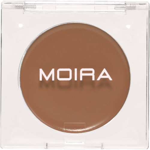 En rund bruns kosmetisk produkt märkt 'MOIRA' i ett transparent plastlock.