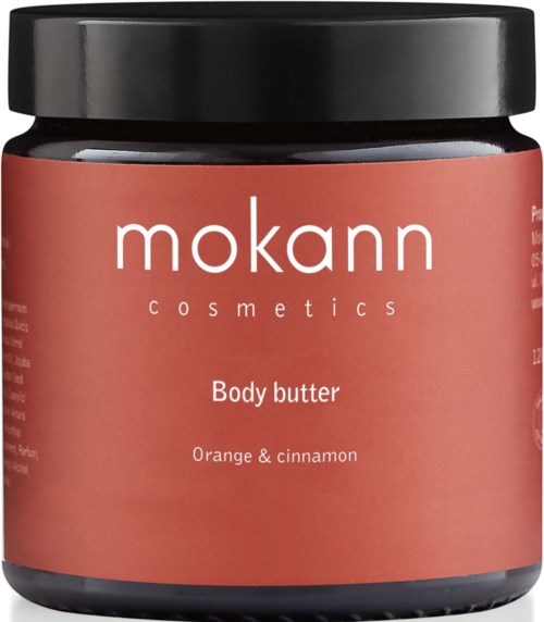 En krukke med kroppsbalsam merket 'Mokann Cosmetics' med duft av appelsin og kanel.