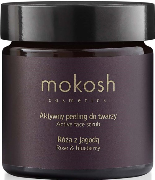 A dark purple jar with a black lid. Label says Mokosh cosmetics, active face scrub with rose and blueberry.