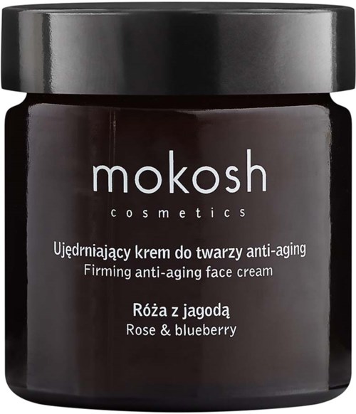 A dark-colored jar with a black lid, labeled 'mokosh cosmetics' and details about an anti-aging face cream with rose and blueberry.