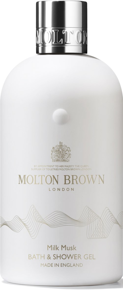 A white bottle with a silver cap labeled Molton Brown Milk Musk bath and shower gel.