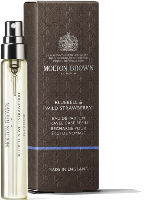 En liten parfymflaska och en brun box med blå och vita text för Molton Brown reseparfym.