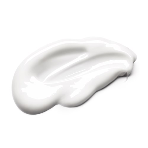 En klick vit kräm eller lotion med en slät, glänsande yta på en vit bakgrund.