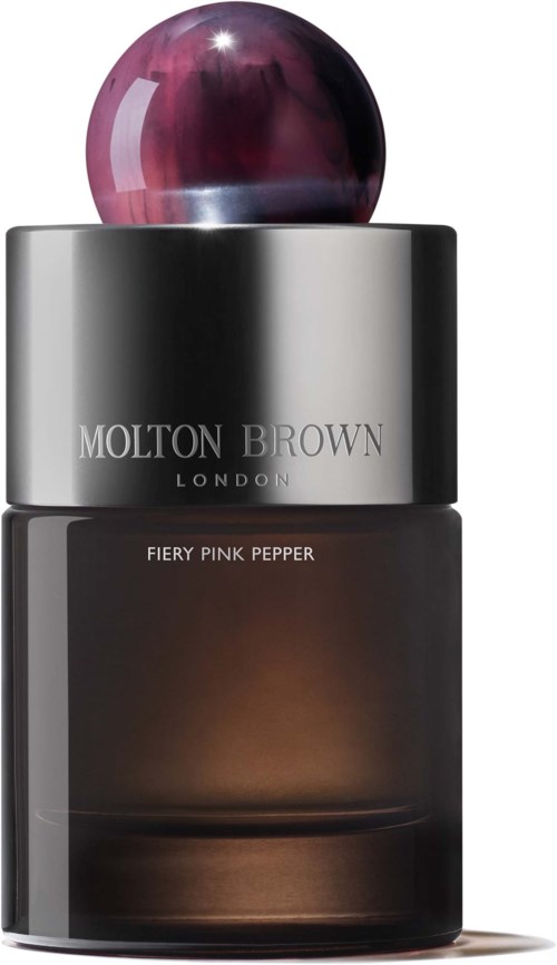 Ein Molton Brown London Parfümflasche mit dunklem Glas und rundem pink-violettem Deckel.