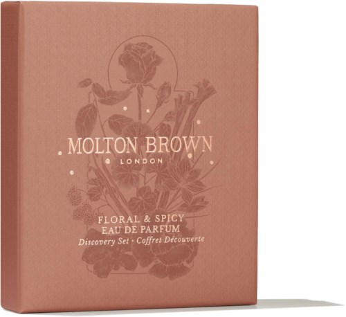 En rosa låda med blomsterdesign och orden 'Molton Brown London' och 'Floral & Spicy Eau de Parfum'.