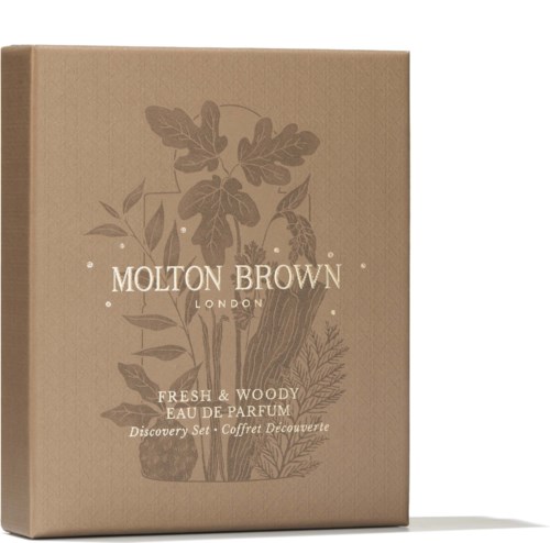 En papplåda med växtillustrationer och text om Molton Brown-parfymset.