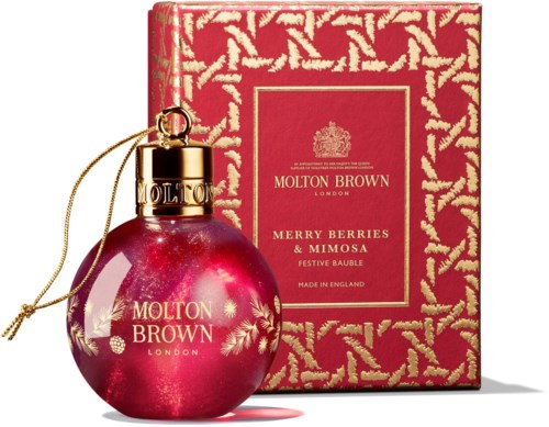 A festive perfume with a red, round bottle and gold cap, and a matching patterned red box.