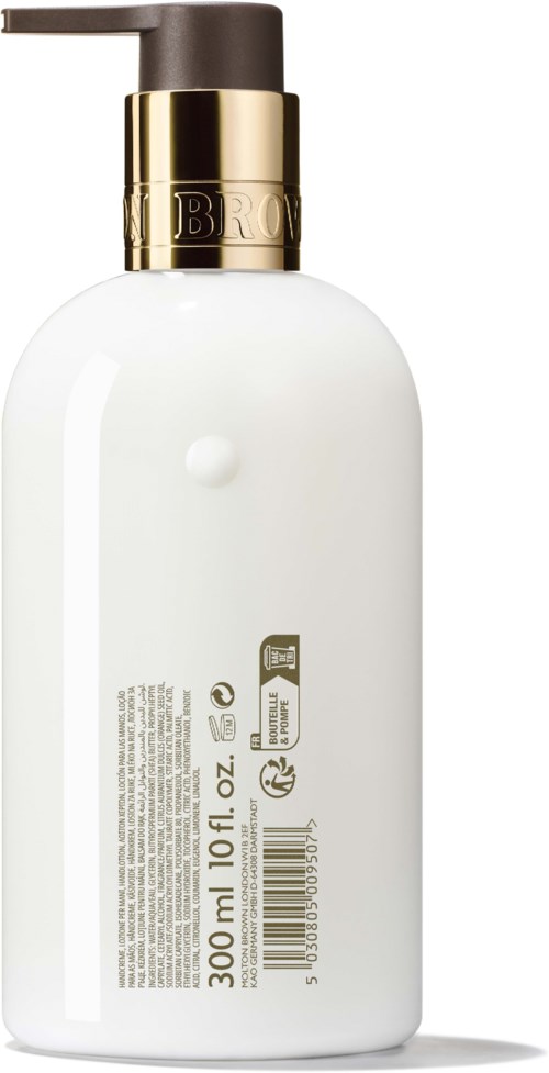 Biała butelka z czarną i złotą pompką, zawiera 300 ml produktu, z tekstem i symbolami na etykiecie.