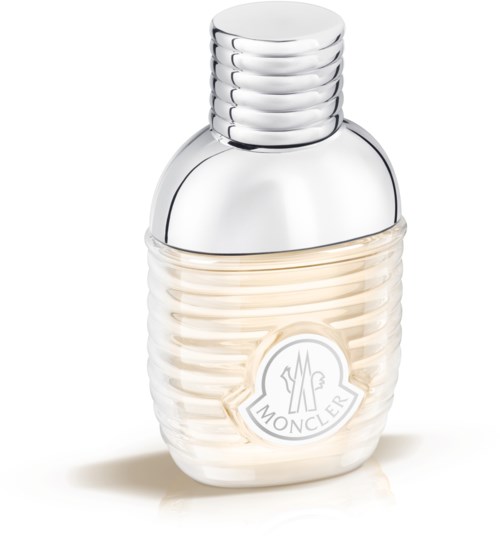A small, cream-colored perfume bottle with a ribbed design and a silver rounded cap. The brand logo is on the front.