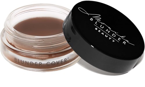 A small round cream container with a black lid, labeled "Blunder Cover" by MAC. The lid is slightly open.