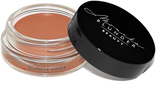 A small round container of BC concealer with a black lid, labeled 'Blunder Cover,' is shown open.