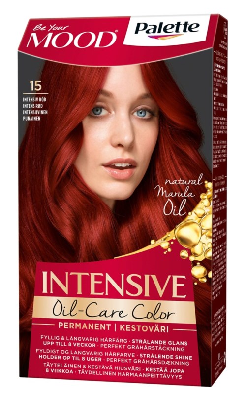 Red-haired woman with blue eyes on hair dye box. Text includes brand, shade, and natural manula oil benefits.