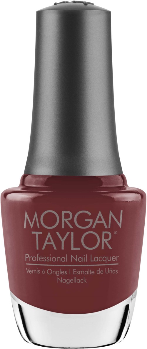 Röd nagellackflaska med silverlock, etiketten säger Morgan Taylor, professionell nagellack.
