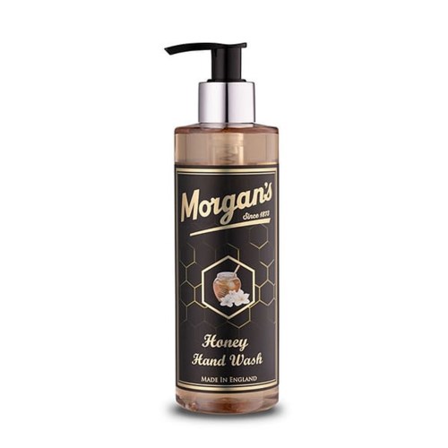 Przezroczysta butelka z czarnym dozownikiem, oznaczona Morgan's Honey Hand Wash, z ilustracjami miodu i plastra miodu.
