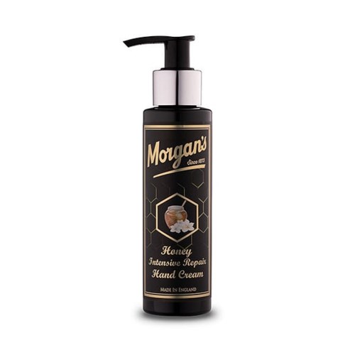 En svart flaske med pumpe, merket Morgan's Honey Hand Cream, i gull- og hvit tekst, og honningkake-grafikk.