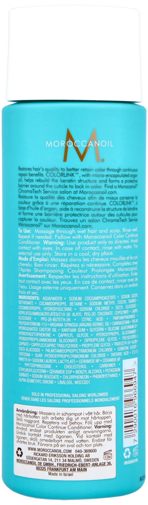Blå flaska med vit kork, etikett som visar varumärket Moroccanoil, mest text, inga bilder eller grafik.