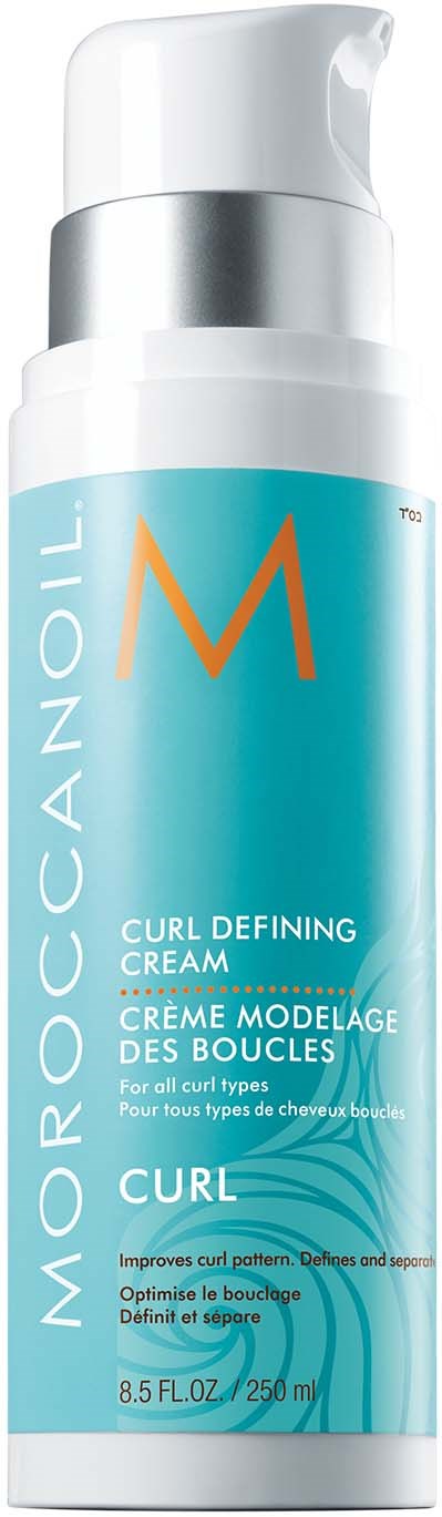 Długa turkusowa butelka z białą i srebrną nakrętką, oznaczona jako Moroccanoil Curl Defining Cream, do stylizacji włosów.