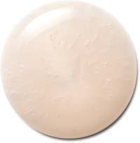 A round, smooth, beige-colored object, possibly a stone or a button.