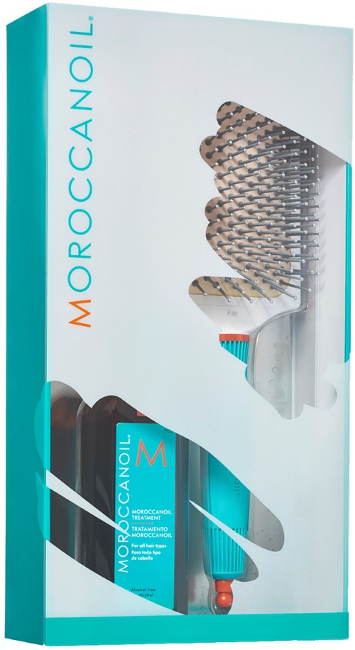 En låda med en tandborste inuti, märkt Moroccanoil, med en färgglad logga och text på förpackningen.