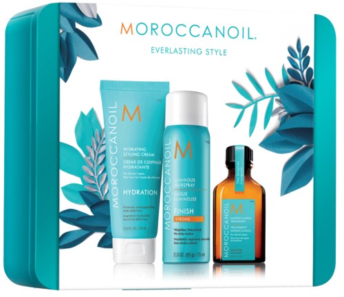Tre Moroccanoil hårprodukter: stylingkräm, hårspray och olja, med blå blad i bakgrunden, i en turkos box.