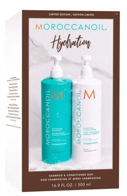 Två flaskor märkta Moroccanoil hydration, en blå och en vit, på en box med en molnig bakgrund. Det är ett schampo och balsam-set.