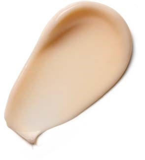 A dollop of beige-colored cream or lotion, shaped like a teardrop, on a white background.