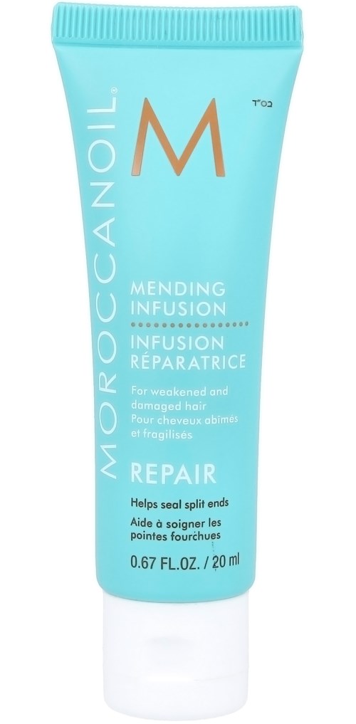 Pieni sininen puteli MoroccanOil-korjaavalle hiusvoiteelle ja valkoinen korkki.