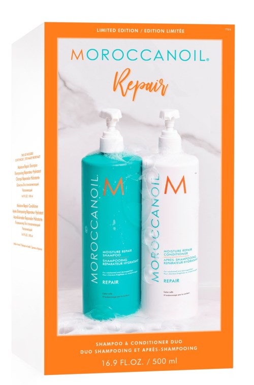 Två flaskor Moroccanoil Repair hårprodukter, en blå och en vit, med pump och orange kant.
