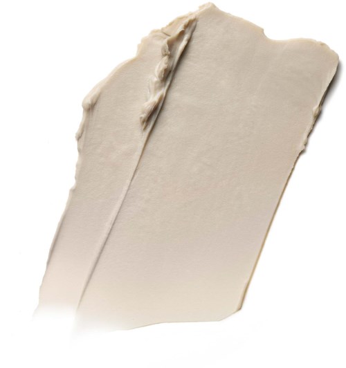 A beige or cream-colored rectangular block with a smooth surface and some texture, resembling a piece of soap or clay.