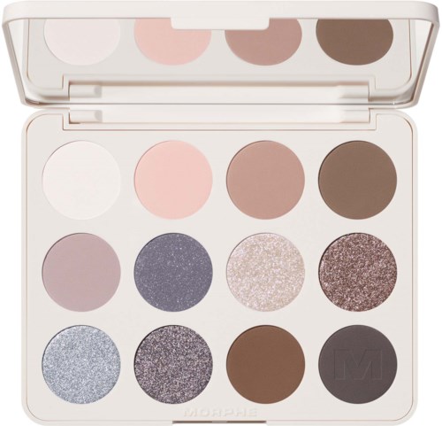 A compact eyeshadow palette with twelve glittery and matte shades in pink, purple, brown, and gray tones.