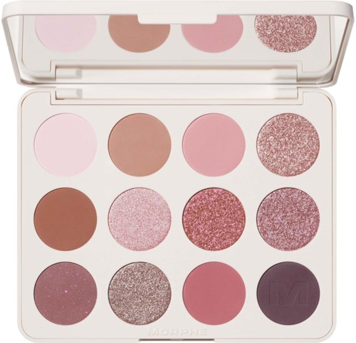 A makeup palette with twelve pink and brown shades, some with shimmer and glitter, arranged in four rows.