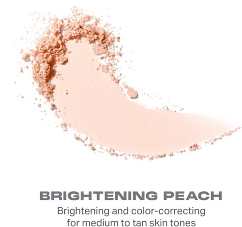 En peachfärgad puder med en kurvad form, används för att ljusa upp och färgkorrigera för medium till solbrända hudtoner.