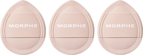 Three Morphe makeup sponges in light pink color are lined up side by side.