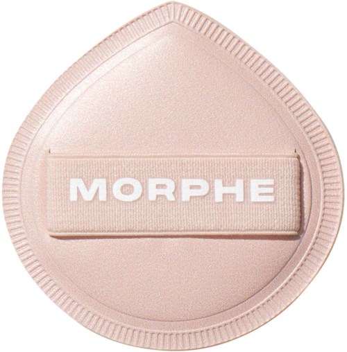 A soft pink makeup sponge with the word MORPHE written on a band across its middle.