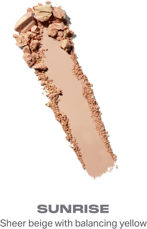 En beige sminke laget med noen knuste biter på toppen, merket Sunrise, beskrevet som lys beige med balanserende gult.