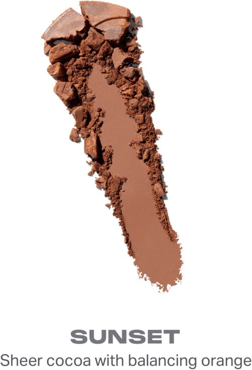 Et ødelagt kakaobart formet som en stor pil peker nedover med oransje inni. Ordet solnedgang står under.