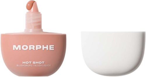 En rosa flaske med Morphe blush og en hvit bolle ved siden av. Flasken har en dråpe på lokket.