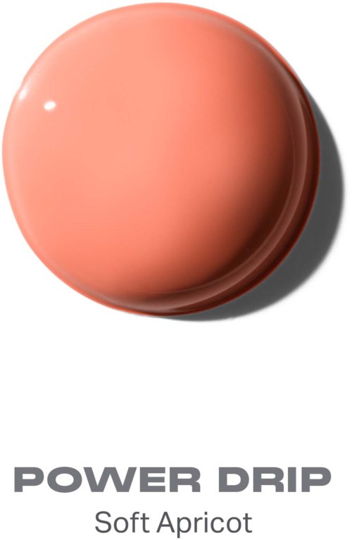 Pyöreä, aprikoosin värinen esine varjolla, jossa lukee Power Drip Soft Apricot.