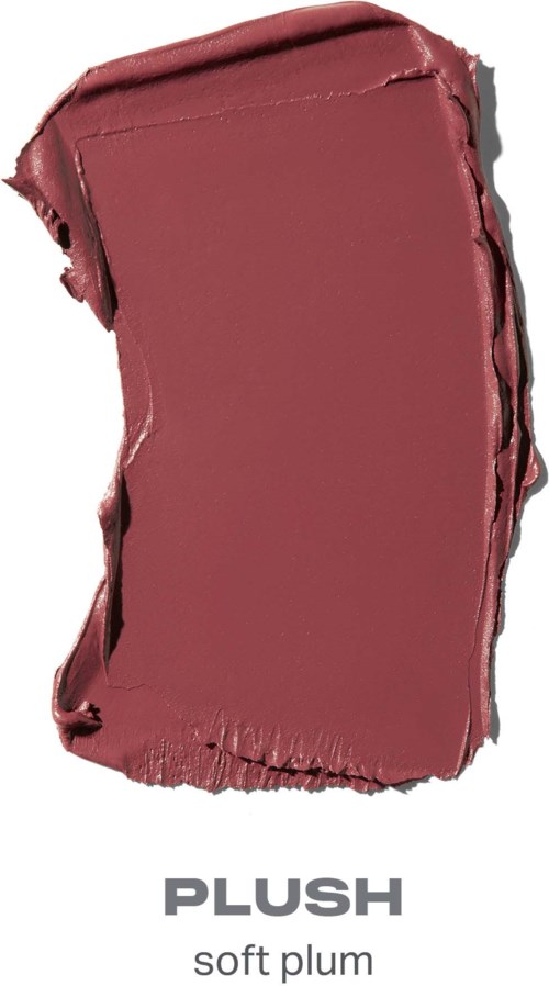 En mjuk plummefärgad makeupprov med ojämnt form och struktur, märkt Plush.