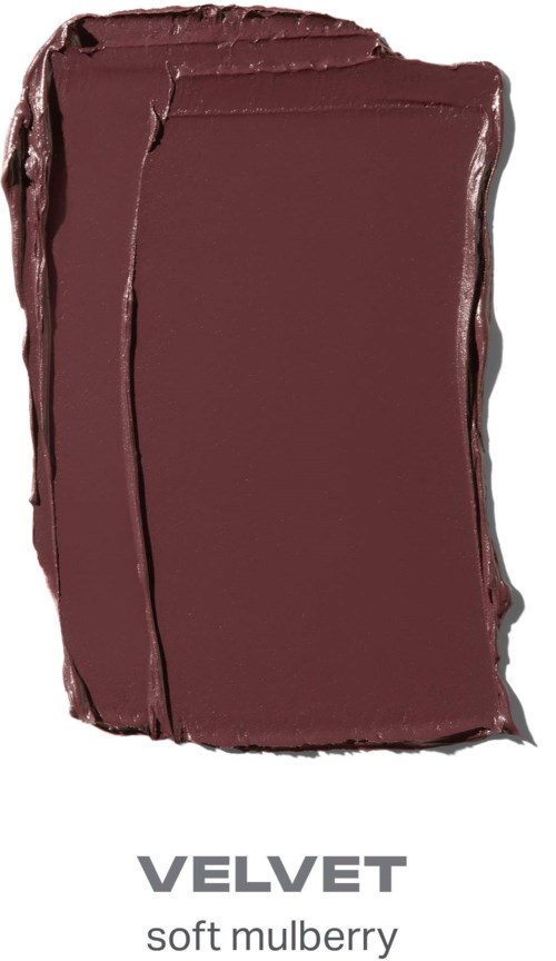 En chokladstav märkt Velvet i en slät, rödbrun färg. Den ser mjuk och krämig ut.