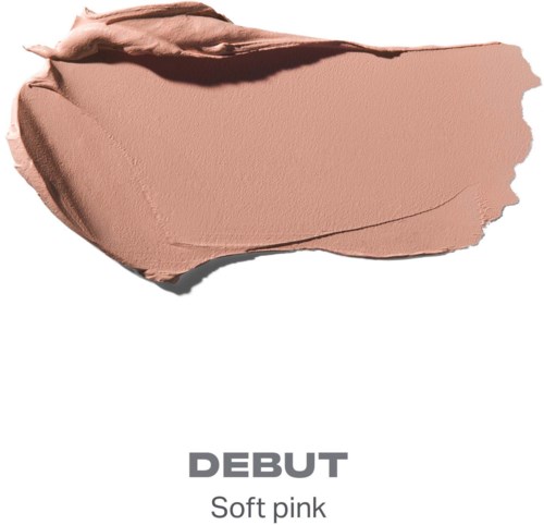 En myk rosa kosmetikkkrem smurt ut på en hvit bakgrunn med ordene DEBUT og Soft pink under.