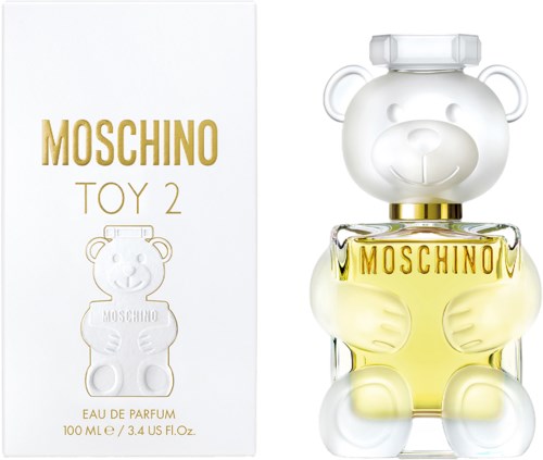 Eine Moschino Toy 2 Parfügiveutel in Form eines weißen Bären, der eine gelbe Flüssigkeit hält.
