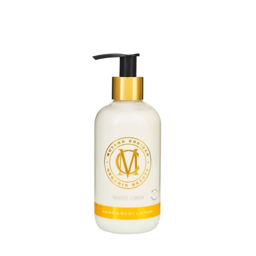 En hvit lotionflaske med svart pumpe, gullkrage og oransje etikett med teksten "Hand & Body Lotion."