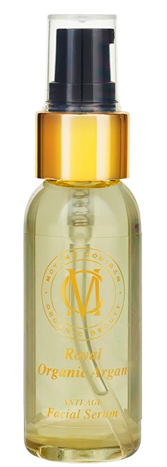 En liten, klar flaske med pumpe, merket 'Royal Organic Argan' og 'Anti-Age Facial Serum' i gullfarge.