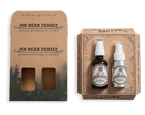 Två små flaskor av skötselsprodukter i en kartong för män, märkta 'Mr Bear Family' med träd och text.