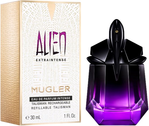 En parfyllflaska formad som en raket med svart och lila färger bredvid en låda med Alien Mugler parfym.