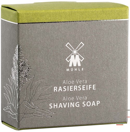 Box with aloe vera shaving soap from Mühle, featuring a windmill logo and botanical illustrations on the packaging.