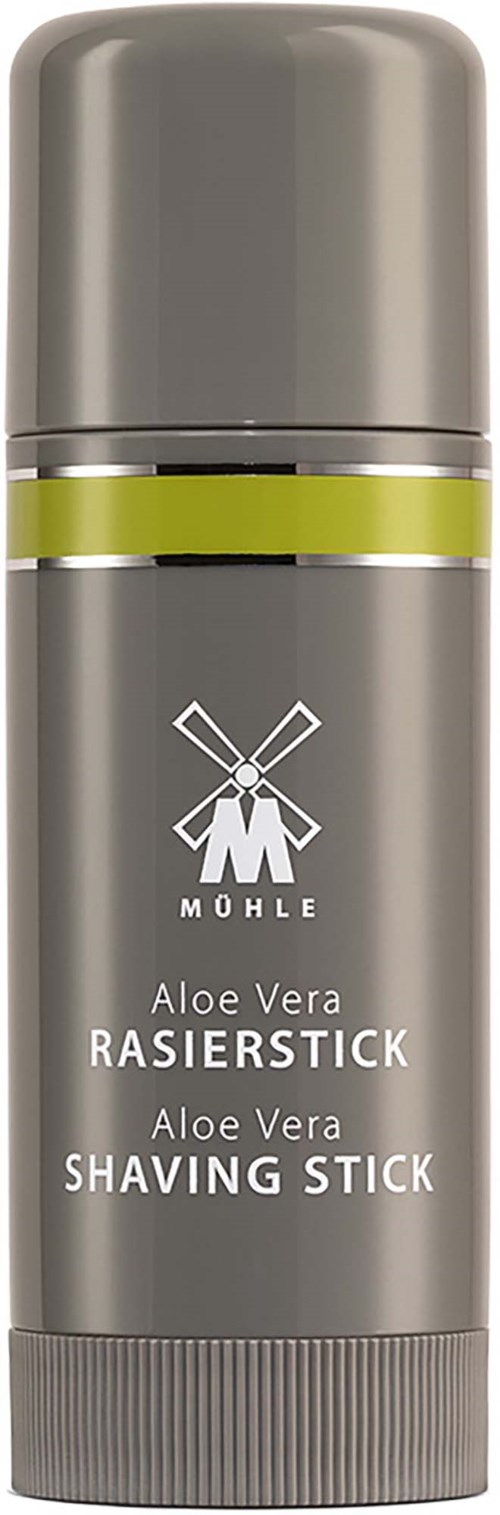 En grå barberstiftbeholder med en grøn stribe og en vindmøllelogo, mærket Aloe Vera Raserstick.